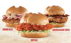 three sandwiches with different toppings are shown in this advertisement for the chicken sandwich swiss