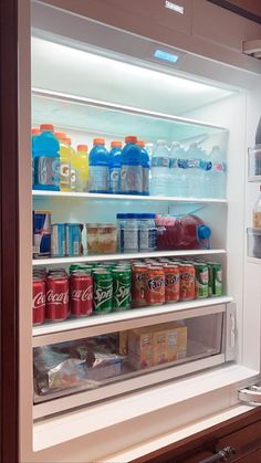 an open refrigerator filled with lots of drinks