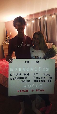 a man and woman standing next to each other holding a sign that says i'd be speciales starting at you standing there in your dress at