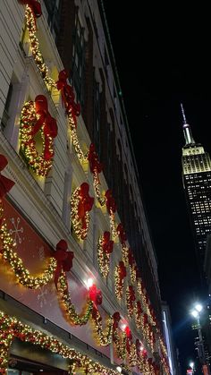 christmas lights adorn the side of a building in new york city