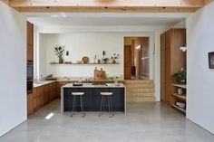 the kitchen is clean and ready to be used as a dining room or living room