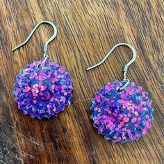 These earrings are handmade by me. They contain color shifting purple to pink glitter cured in small pieces of resin with stainless steel ear wires and silicone earring backs. They are super lightweight and comfortable! Please note that due to the handmade nature of the product, there may be slight variations between the two earrings. If you are local (Opelika/Auburn Alabama) and would like to pick up the earrings in person rather than paying for shipping, please use the coupon code LOCALPICKUP, Purple Glitter Earrings For Gift, Purple Flower Earrings For Party With Ear Wire, Auburn Alabama, Glitter Flowers, Pink Glitter, Earring Backs, Auburn, Flower Earrings, Ear Wires