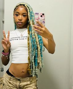 Teal and blue locs Blue Green Locs Black Women, Teal Faux Locs, Black And Blue Dreads, Blond And Blue Braids, Teal Locs Black Women, Blue And Blonde Locs, Teal Knotless Braids, Teal And Blonde Hair, Teal Hair Black Women