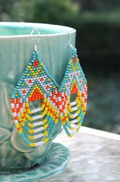 Beautiful summery colors adorn these beautiful seed beaded Native American earrings.  Handcrafted for the person that appreciates one of a kind treasures Indigenous Beadwork, Native Necklace, Large Statement Earrings, Native American Earrings, Native American Beaded Earrings, Handmade Earrings Beaded, Native American Beading, Seed Bead Earrings, Seed Bead Jewelry