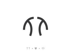 the letter t is made up of two curved lines and has an arrow in it