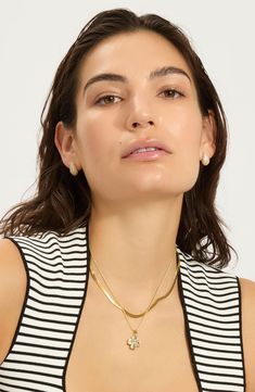 A clover pendant necklace crafted in 14-karat-gold or silvertone plate is a must-have staple for your collection. 15" length; 4" extender; 1/2"W x 1/2"L pendant 14k-gold plate or silvertone plate/glass Imported Gold-tone Clavicle Chain Charm Necklace, Tarnish Resistant Yellow Gold Charm Necklace, Elegant Plated Charm Necklaces, Gold Plated Charm Necklace With Pearl Pendant, Classic Chain Necklace With Round Pendant, Gold-tone Initial Pendant Charm Necklaces, White Tarnish-resistant Charm Necklace, Calpak Luggage, Clover Pendant