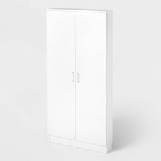 a tall white cabinet with two doors