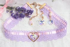 ~ 🎀 ~  ~ ♡~ This Beautiful Light purple and pink color Choker made from high quality lace, satin, glass crystal heart charm and gold plated Heart ring. ★ ~ Choker are 3 sizes: ★ ~ Smallest choker Minimal size- 31cm(12.20in), Maximal size- 39cm( 15.33in),  height- 3cm(1.18in)    ★ ~  Medium choker Minimal size- 33.5cm(13.18in), maximal- 42cm(16.53in), height- 3cm(1.18in)  ★ ~the Longest choker Minimal size- 37cm(14.56in), maximal- 47cm(18.50in), height- 3cm(1.18in) The choker finished off with full  width bright gold plated Stainless steel clamp ends, carabiner closure. Metal chain and Teardrop Crystal Glass Bead. ~ ♡~Crystal Heart earrings are adorable, they are made with shining heart, pearls and Gold plated Hooks Earrings size- ★  Width - 1.5 cm(0.59in)  high- 5 cm(1.96in) ★Earrings are Charming Pink Jewelry For Party, Charming Pink Party Jewelry, Cute Purple Jewelry For Party, Feminine Heart Beads Jewelry For Wedding, Charming Pink Heart Jewelry, Charming Pink Heart-shaped Jewelry, Cute Purple Party Jewelry, Pink Heart Beads Jewelry For Wedding, Cute Party Jewelry With Heart Charm