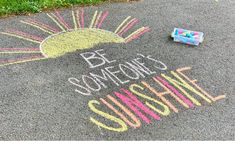 some chalk writing on the ground with crayons