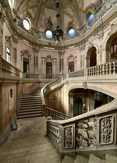 an ornate staircase in the middle of a building