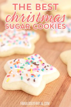 the best christmas sugar cookies with sprinkles and frosting are on a cutting board