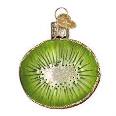 a green kiwi ornament hanging from a chain