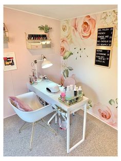 a room with a desk, chair and flowers on the wall