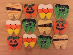 decorated cookies with halloween teeth and pumpkins on them