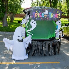 an inflatable trick - or - treat display with ghost and ghost characters