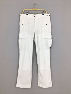 Size 36x32.5 Polo Ralph Lauren Cargo White Pants Casual Polo Ralph Lauren Pants Multi Pocket Utility Surplus Ralph Lauren Pant W36 Please contact me for any questions about this clothing before buying. SIZE MEASUREMENTS :- WAIST : 36" inches HIPS : 42" inches THIGH: 24" inches  LEG OPENING : 20" inches RISE : 11" inches INSEAM : 32.5" inches OUTSEAM (TOTAL LENGTH) : 43" inches WEIGHT : 0.76 kg Condition : Good Condition. No holes and no stains. Please pay close attention to measurements provided White Full-length Bottoms With Belt Loops, White Full Length Pants With Belt Loops, White Full Length Cargo Pants With Multiple Pockets, White Work Pants With Multiple Pockets, White Workwear Pants With Multiple Pockets, White Straight Leg Pants With Multiple Pockets, White Workwear Pants With Hip Pockets, White Pants With Hip Pockets For Work, White Workwear Bottoms With Multiple Pockets