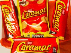 three bags of caramel candy are stacked on top of each other in front of a white background