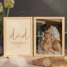 Capture special memories with a Personalized Father's Day Wooden Frame. This custom engraved photo gift box is the perfect keepsake for dads and partners.When it comes to celebrating the special men in our lives, nothing says 'I appreciate you' quite like a Personalized Father's Day Wooden Frame. This beautifully crafted hinged wooden picture frame is more than just a place to display cherished photographs; it's a timeless keepsake that captures the essence of love, appreciation, and personal me Father's Day Photo Frame, Fathers Day Pictures, Unique Gifts For Dad, Unique Valentines Day Gifts, Personalized Photo Frames, First Fathers Day Gifts, Wood Photo Frame, Wooden Keepsake Box, Wooden Photo Frames