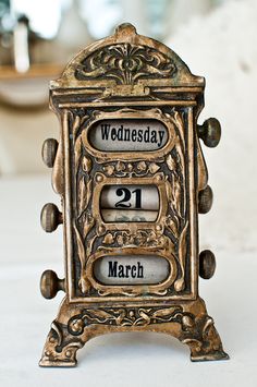 an old fashioned clock with the date on it