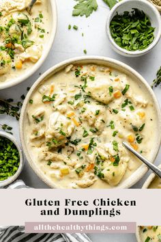 two bowls filled with chicken and dumplings on top of a white table next to spoons