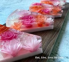 three soap bars with pink and orange flowers on them