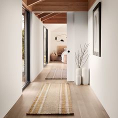 the hallway is clean and ready for us to use as an entrance way in this modern home