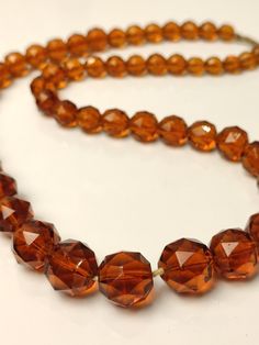 Luxury Elegant Czech Glass Necklaces, Elegant Amber Crystal Necklaces With Round Beads, Elegant Amber Crystal Necklace With Round Beads, Amber Round Beaded Costume Necklace, Amber Round Beads Costume Jewelry Necklace, Amber Beaded Costume Jewelry Necklace, Amber Beaded Costume Jewelry Necklaces, Round Glass Beads For Jewelry Making, Single Strand Round Glass Beads