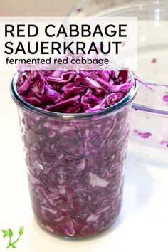 red cabbage sauerkraut in a glass jar with text overlay reading red cabbage sauerkraut fermented red cabbage