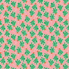 a pink background with green leaves on it