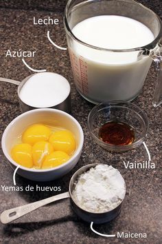 ingredients to make chocolate cake sitting on a counter top with measuring cups and spoons