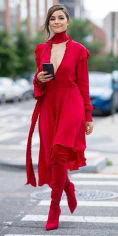 Olivia Culpo channeled her inner dancing lady emoji while out in Long Island City, wearing a killer all red everything ensemble: a plunging Magda Butrym dress with asymmetrical sleeves, a matching scarf, and thigh-high pointed toe boots.  S Red Monochromatic, Olivia Culpo Style, Street Outfits, Olivia Culpo, Outfit Trends