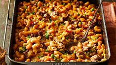 a casserole dish filled with pasta and meat