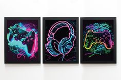 three neon colored video game controllers are displayed on a white wall with black framed artwork