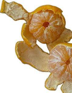 two peeled oranges sitting on top of each other