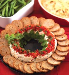 a platter filled with crackers and dip