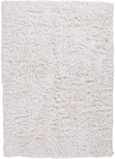 a white shaggy rug on a white background