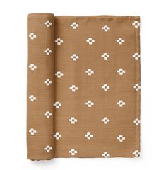 a brown and white blanket with crosses on it