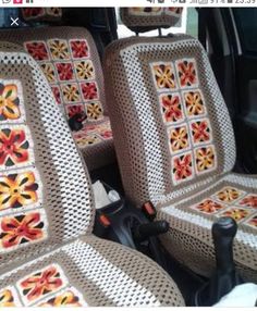 the interior of a car with two rows of seats covered in crocheted material