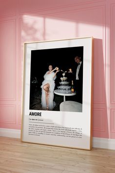 a woman in a white dress standing next to a cake on top of a table