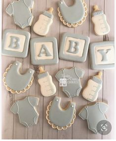 baby shower cookies are arranged on a table