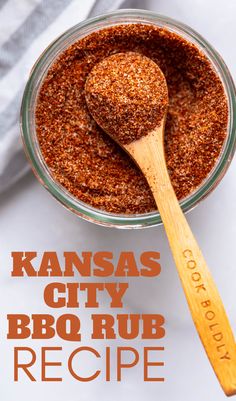 kansas city bbq rub recipe in a glass bowl with wooden spoon