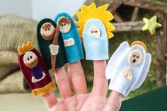 five finger puppets are placed in the palm of someone's hand