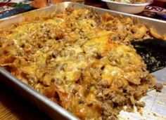 a casserole dish with meat and cheese in it