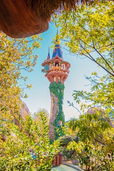 the tower is surrounded by greenery and trees