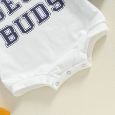 Experience maximum comfort and style with our BEST BUDS Color Block Onesie, perfect for celebrating your little one's friendships! Its cool color block sleeves and adorable "best bud" prints make a statement for any best buds. Casual Onesie With Letter Print For Playwear, Cotton Onesie With Letter Print For Playtime, White Onesie With Cartoon Print For Playwear, Cute Onesie With Letter Print For Playwear, Cute Onesie With Letter Print For Playtime, Cute Letter Print Onesie For Playtime, White Cartoon Print Onesie For Playwear, Casual Unisex Onesie With Letter Print, Cute White Onesie With Character Print