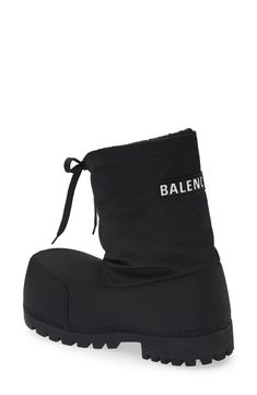 Balenciaga's extreme aesthetic and exaggerated proportions define a boldly branded puffer boot that features a chunky lugged sole and drawstring-cinched cuff. Pull-on style with drawstring closure Textile upper and lining/rubber sole Made in Italy Designer Shoes Designer High-top Winter Boots, Designer Winter Boots With Lug Sole, Nylon Boots For Winter Streetwear, Winter Nylon Boots For Streetwear, Winter Streetwear Nylon Boots, Extreme Aesthetic, Fem Outfits, Balenciaga Boots, Balenciaga Shoes