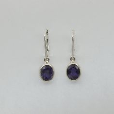 These is a pair of beautiful Earrings with Iolite. The earrings are made out of solid 925 Silver and there is no nickel or other substances causing most allergies. This makes the earrings hypo allergenic. Size of one Earring in total 3.0 x 0.9 cm or 1.18 x 0.35 inch The hooks are about 1.8 - or a bit less than 3/4 inch - in length. You will receive the item in a gift box - perfect to surprise someone or yourself. Usually we ship on the same day we receive the payment for the order. We want you t Everyday Oval Earrings With Lever Back, Classic Nickel-free Oval Earrings, Hypoallergenic Oval Earrings For Formal Occasions, Classic Oval Sterling Silver Earrings, Sterling Silver Oval Earrings With Ear Wire, Silver Oval Earrings With Lever Back Ear Wires, Nickel Free Oval Earrings For Formal Occasions, Formal Oval Sterling Silver Earrings, Oval Earrings