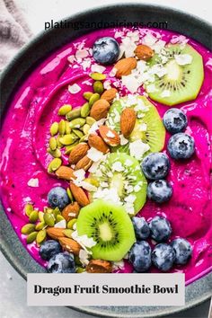 dragon fruit smoothie bowl with blueberries, kiwi and almonds on top