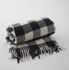 a black and white checkered blanket folded on top of each other