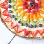 there is a pie with fruit on it